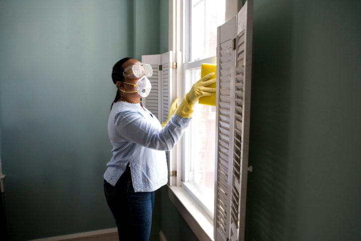 Pest control technician in protective gear